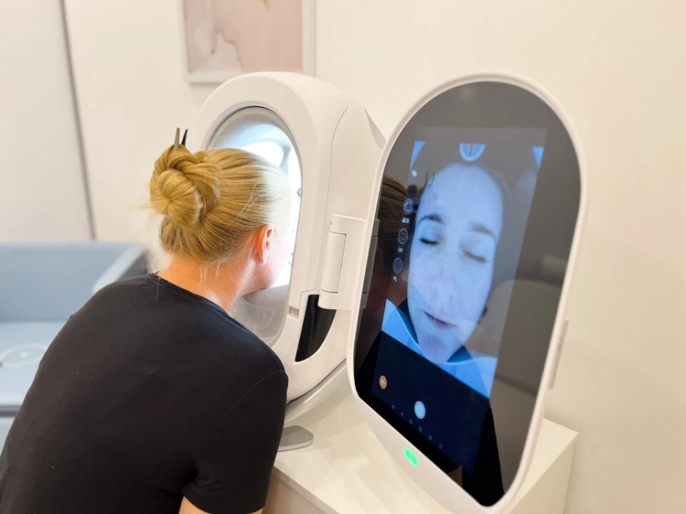 Facial skin analysis scanner in use
